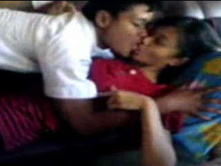 Indonesian lovers kissing and pressing boobs